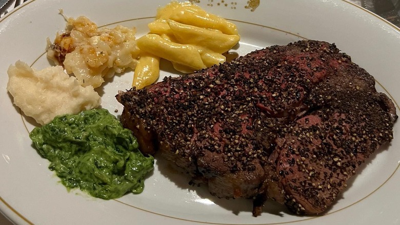 steak on plate with sides