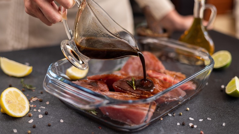 Person marinating steak