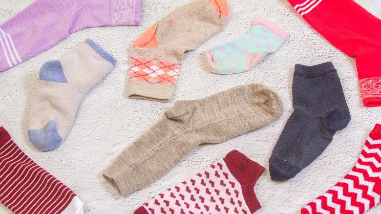 mismatched socks scattered on floor