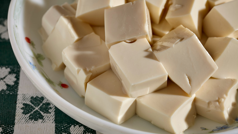 Cubed silken tofu in bowl