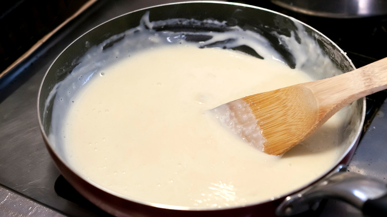 Béchamel sauce in saucepan