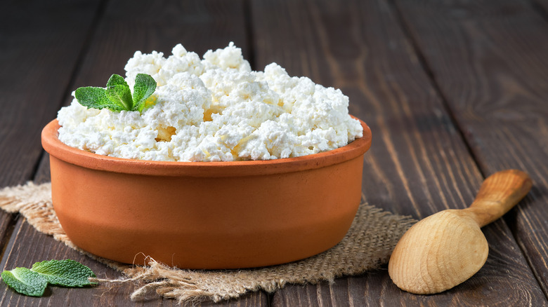 Cottage cheese in clay bowl