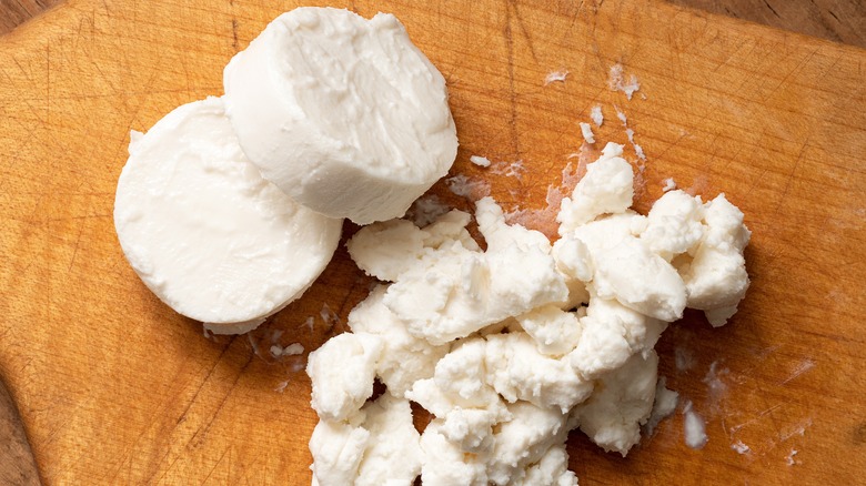 Goat cheese on cutting board