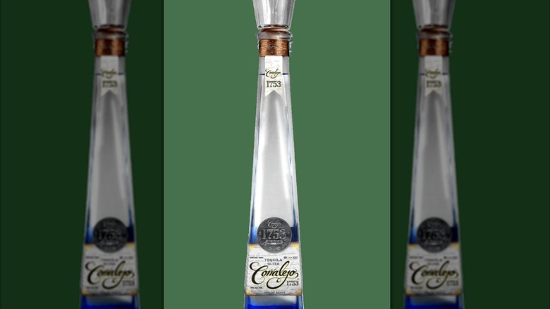 Bottle of Tequila Corralejo Silver before green background