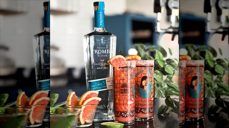 Bottle of Tromba Blanco with two Paloma cocktails