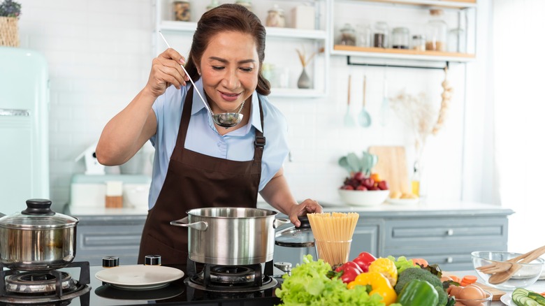 Woman tasting food