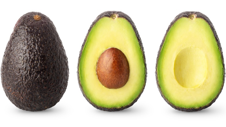 Three avocados against white backdrop