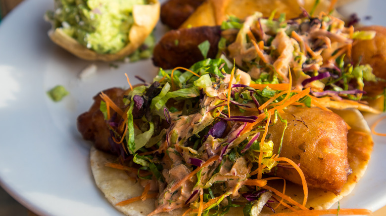 Fried fish tacos with slaw topping