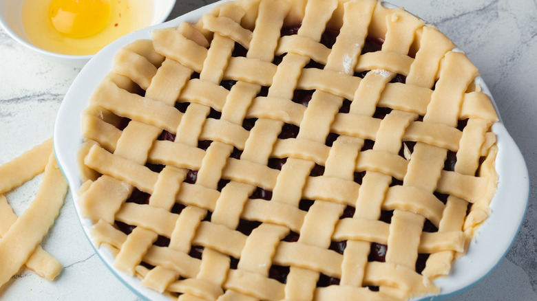 Unbaked cherry pie on kitchen counter