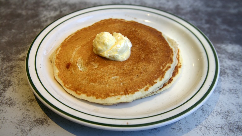 Pancakes on plate with butter