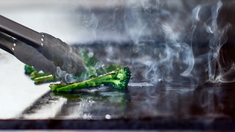 turning broccoli on griddle cooktop 