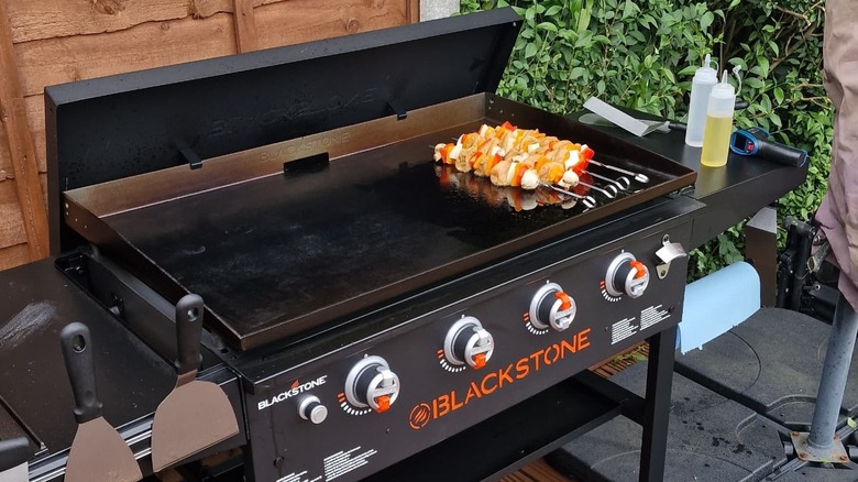 kebabs cooking on Blackstone griddle