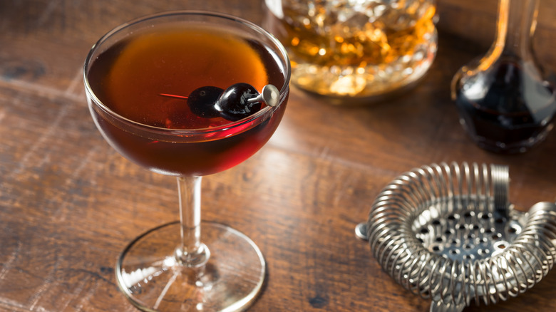 Manhattan cocktail with cherry garnish