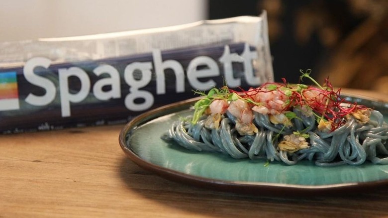 Dish of aqua-colored spaghetti