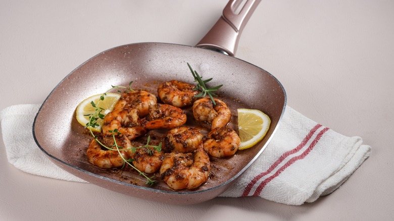 shrimp with seasoning in pan