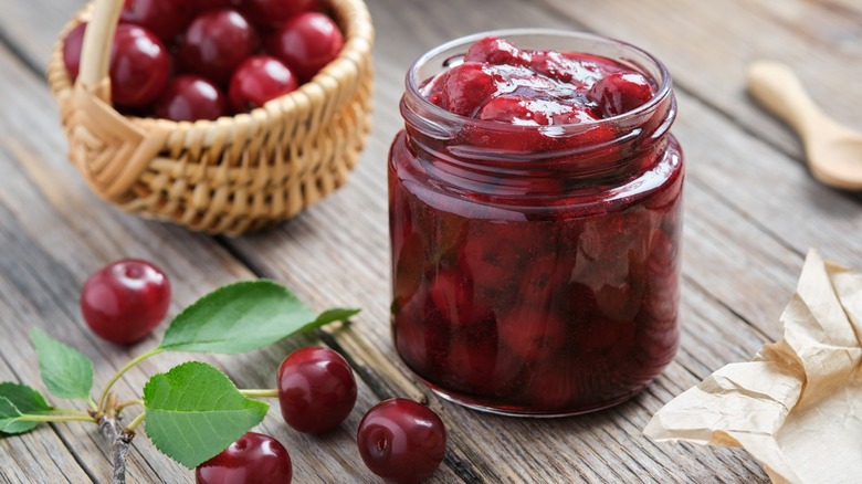 Cherries on counter in jar