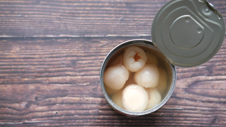 Canned lychees on counter