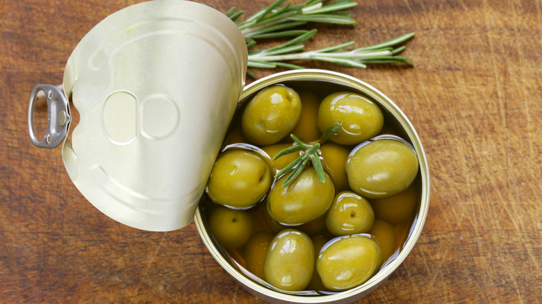 Canned olives on counter