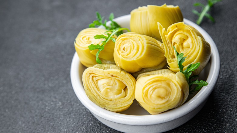 Canned artichoke hearts in a bowl