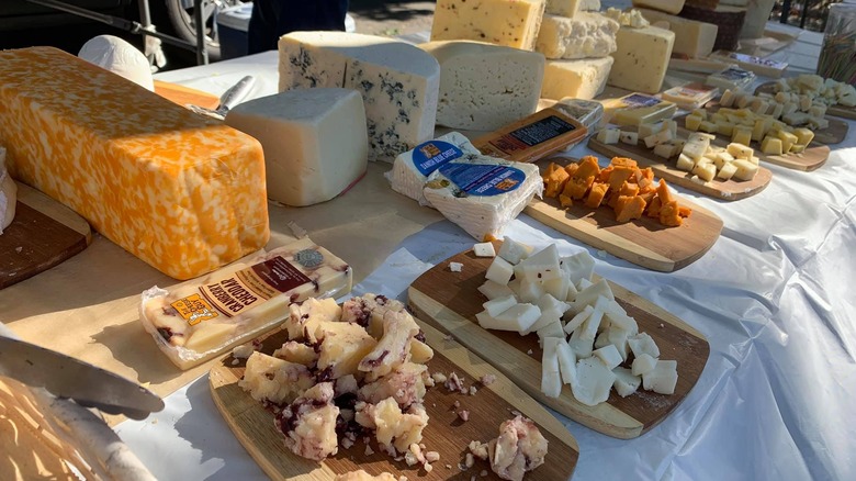 Various cheeses on table