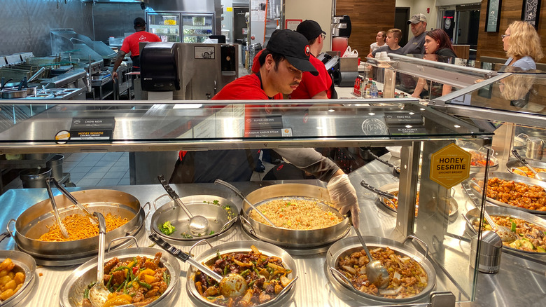 serving dishes of food at panda express