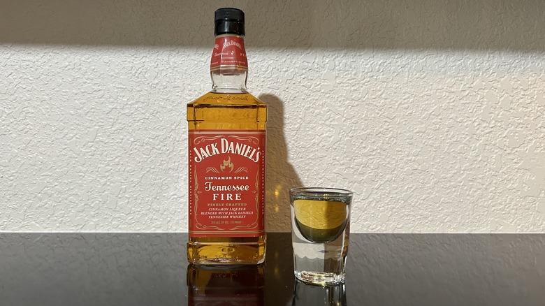 A bottle and shot of Jack Daniel's Tennessee Fire