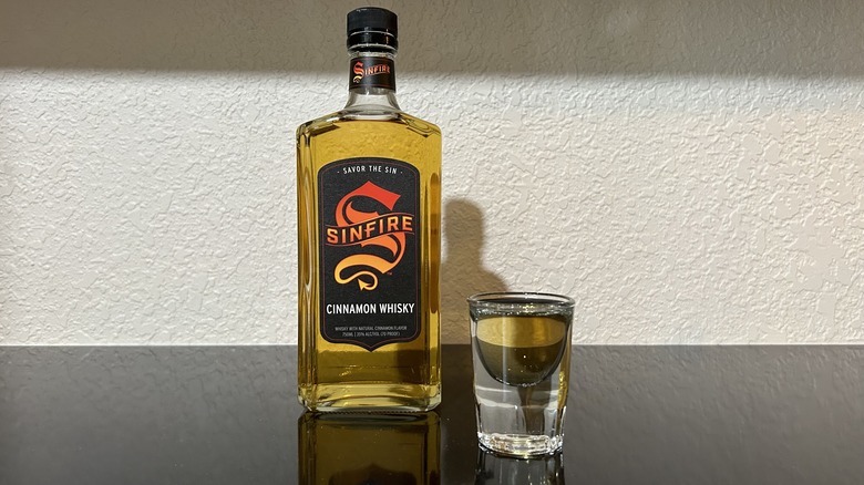 Bottle and shot of Sinfire Cinnamon Whiskey