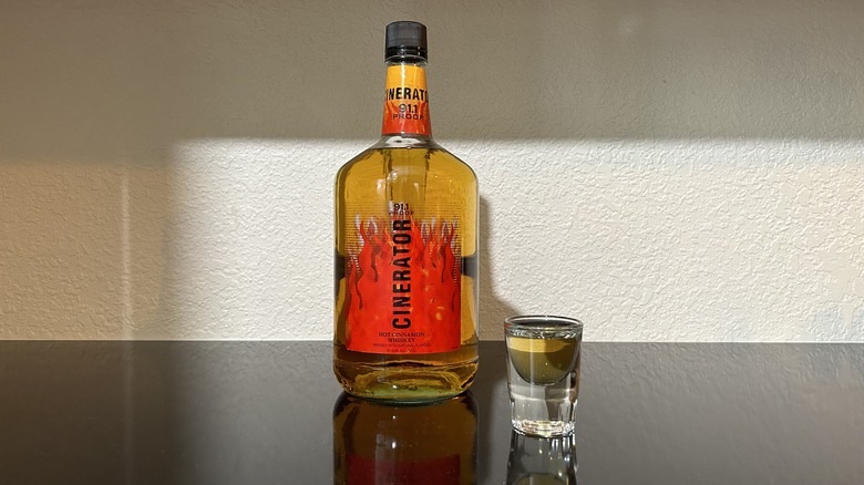 A bottle and shot of Cinerator Hot Cinnamon Whiskey