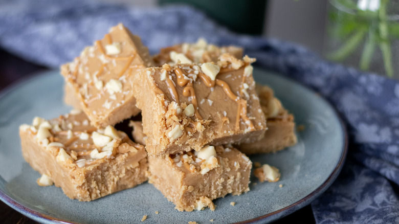 Peanut butter fudge stacked on plate