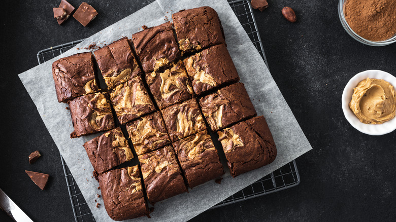 Peanut butter-swirled brownies sitting on wire rack