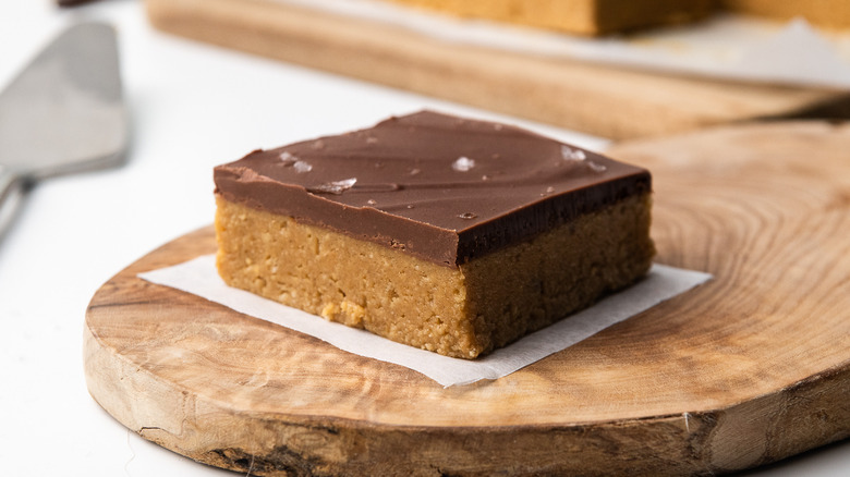 Chocolate-covered peanut butter bar slice