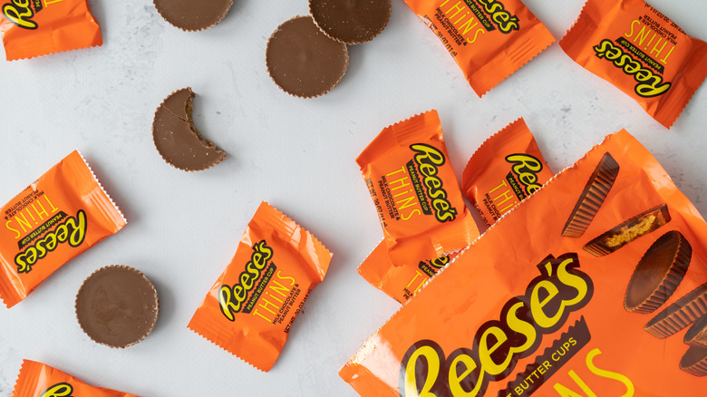 Reese's peanut butter cups with wrappers and bag