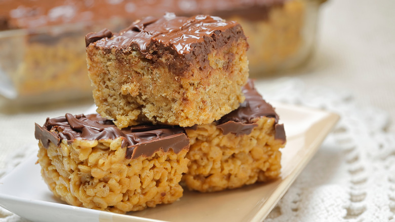 Chocolate-topped peanut butter Rice Krispie treats on plate