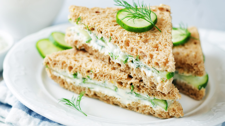 Cucumber sandwich on white plate