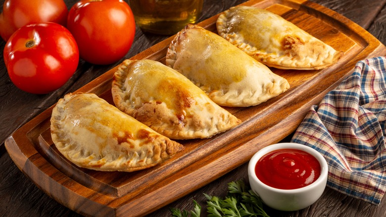 beef empanadas on wooden board