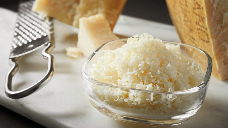 Glass bowl of Parmesan cheese