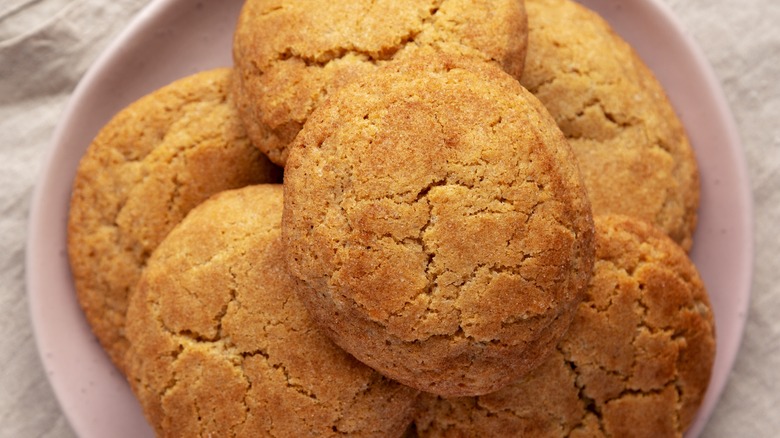 Close-up of snickerdoodle cookies stacked on a pink plate