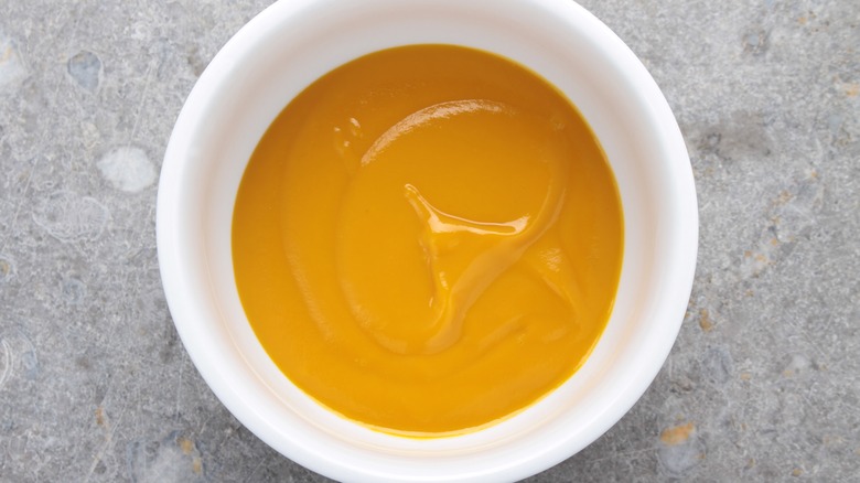 Mango puree in a white bowl