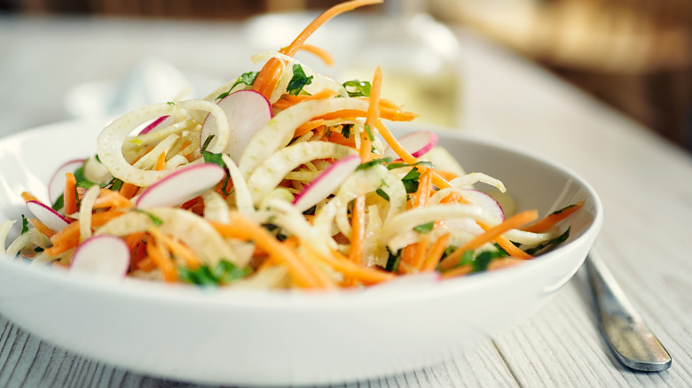 colorful coleslaw in white bowl