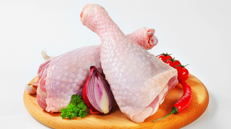 raw turkey legs cutting board