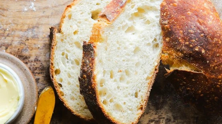 Closeup of fresh-baked sourdough bread on a board