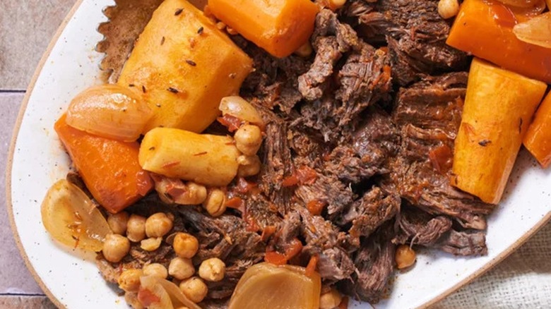 Top-down closeup of harissa pot roast with vegetables 