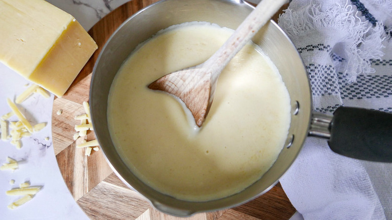 Making cheese sauce in a pan