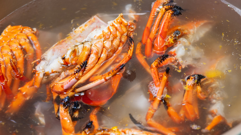 Lobsters boiling in water to make stock