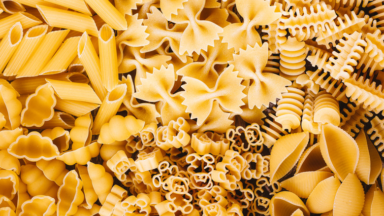 Variety of uncooked pasta shapes in a pile