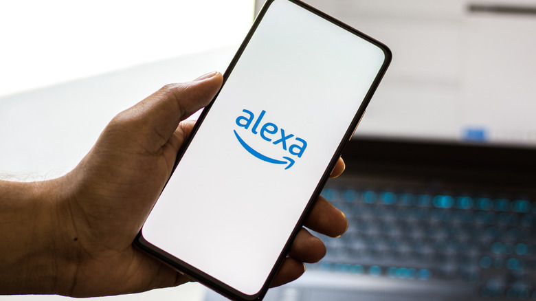 Alexa logo shown on smartphone in someone's hand