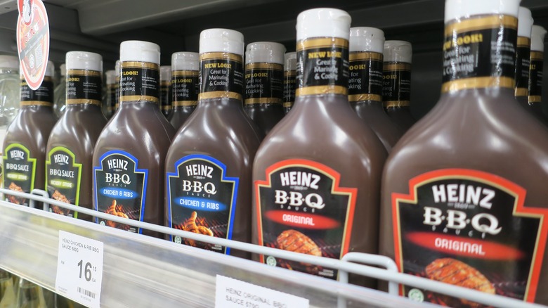 A lineup of barbeque sauces at a grocery store