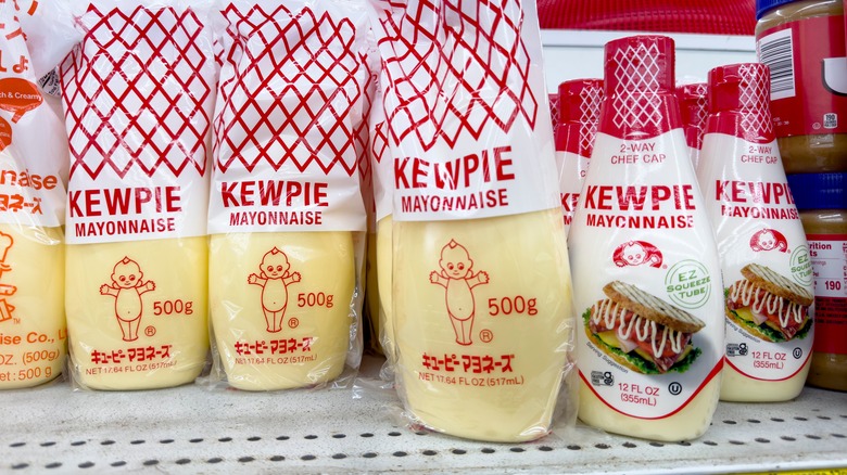 Several containers of Kewpie mayo at a grocery store