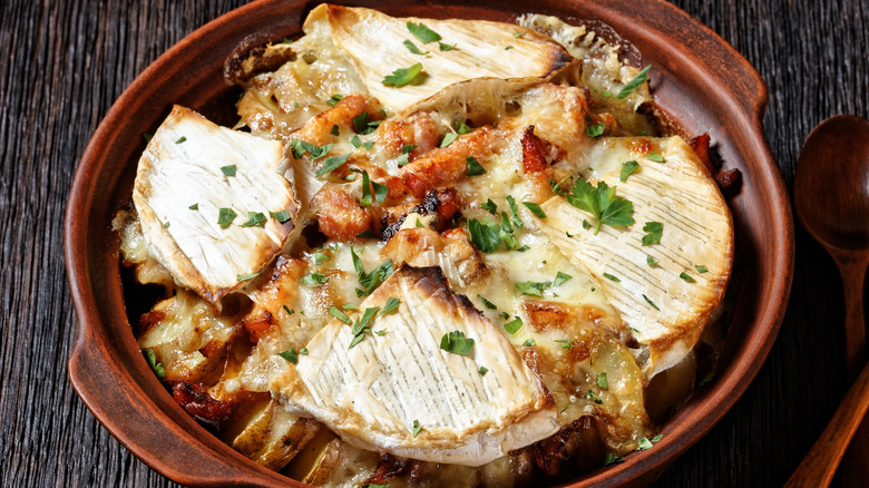 Tartiflette with cheese wedges on top in dish