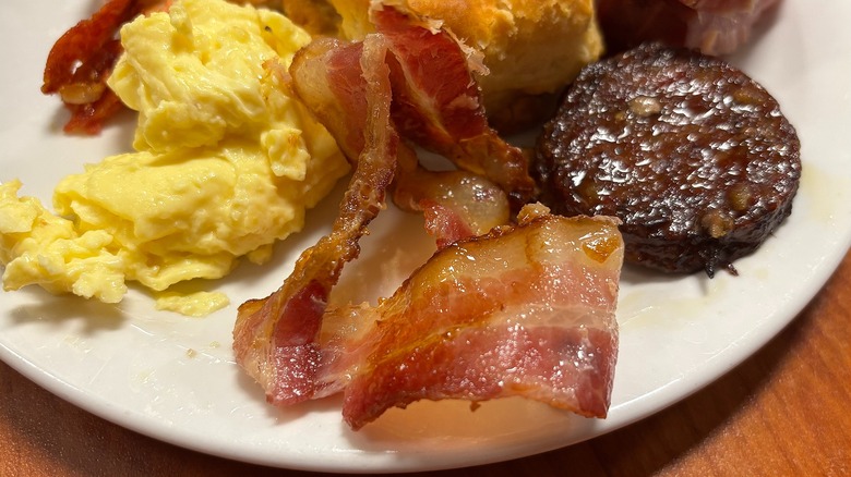 Slice of Golden Corral bacon on white plate